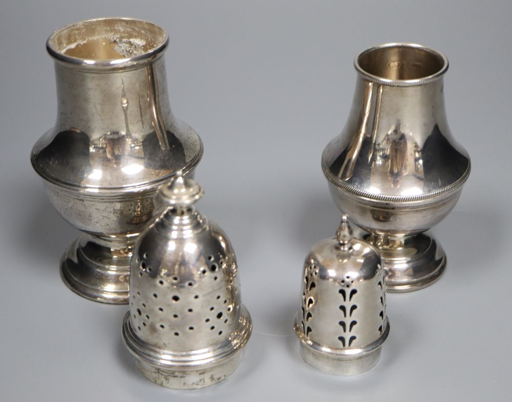 Four assorted 20th century silver casters, including a small pair, tallest 19.3cm, 11.5oz.